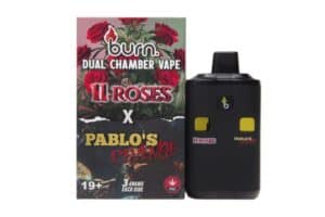 Vape device with dual chambers and THC-related branding, featuring a box with roses, cannabis leaves, and "11 Roses" text, designed for cannabis vape enthusiasts.