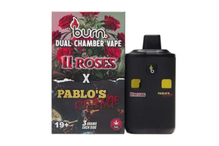 Vape device with dual chambers and THC-related branding, featuring a box with roses, cannabis leaves, and "11 Roses" text, designed for cannabis vape enthusiasts.